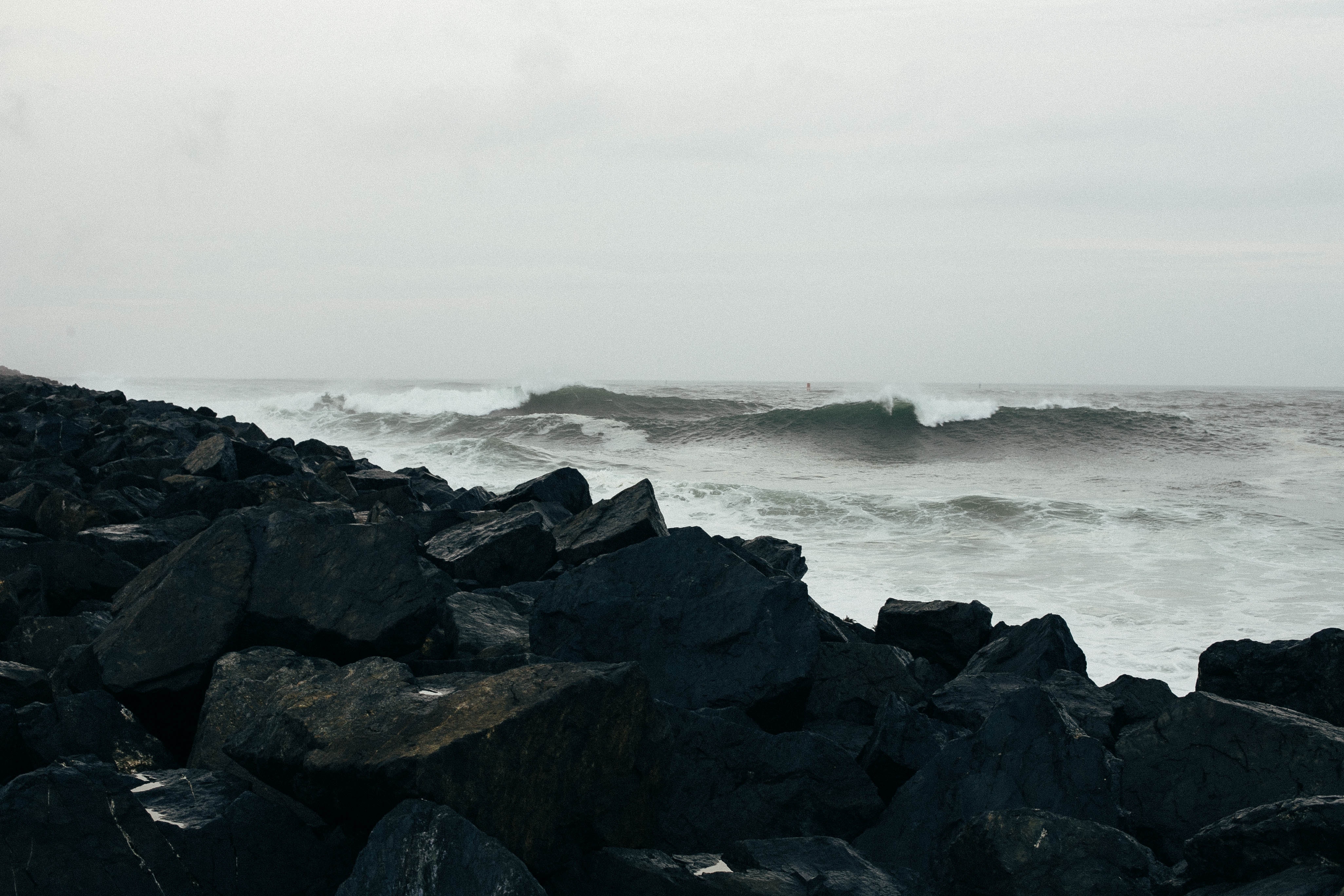 Dark stormy ocean and rocks. Image author unattributed under Creative Commons free use